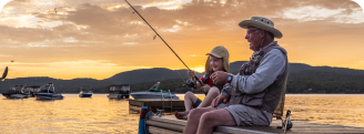 Grandfather and Grandson Fishing on Dock